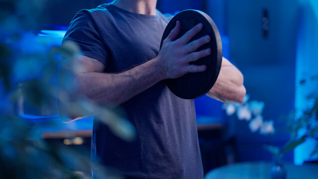 Headless Male Person Chest Exercise With Heavy Plate At Home In Kitchen