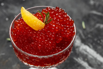 Delicious red caviar in bowl, Close-up salmon caviar. Delicatessen. Gourmet food. Seafood. appetizer, selective focus, place for text,