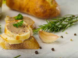 Sandwiches isolated on a white background - slices of a baguette with French foie gras, green...