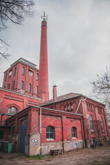 Cultural center Schlachthof Bremen. European industrial brick architecture building. Matte red...