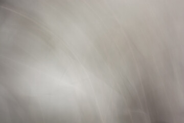 Horizontal background abstraction in gray tones, waves, semicircles, highlights. Backdrop