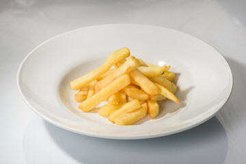 French fries portion on a plate.