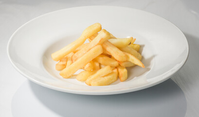 French fries portion on a plate.