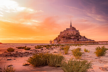Obraz premium Le Mont-Sint- Michel in France by low tide with a beautiful sunset