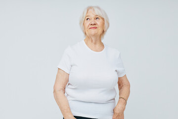 Portrait of an old friendly woman health lifestyle light background