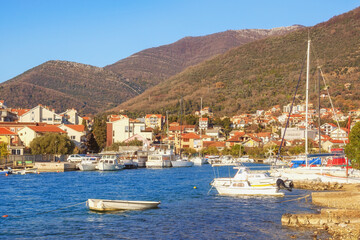 Fototapeta na wymiar Winter Mediterranean landscape. Montenegro, Kotor Bay. View of Tivat city and Marina Kalimanj