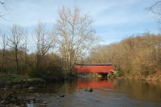 Red covered bridge that crosses the Big Elk Creek, in Fair Hill, Cecil County, Maryland.