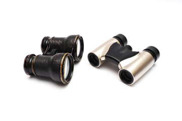 Vintage theater and modern binoculars. isolated over white. A opera glasses