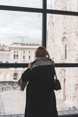 Naklejka premium woman at the window