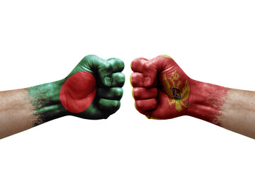 Two hands punch to each others on white background. Country flags painted fists, conflict crisis concept between bangladesh and montenegro