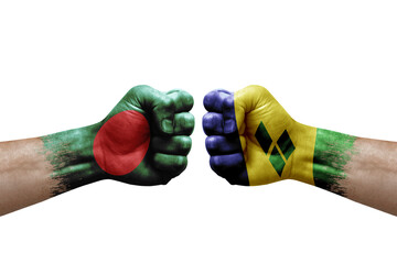 Two hands punch to each others on white background. Country flags painted fists, conflict crisis concept between bangladesh and saint vincent and the grenadines