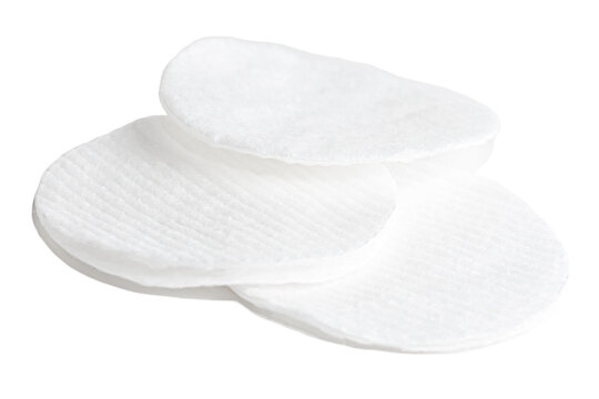 Hygienic cotton pads for wiping and facial skin care on a white background. Disposable cotton rounds for rubbing over the face. Care and hygiene sponge items.