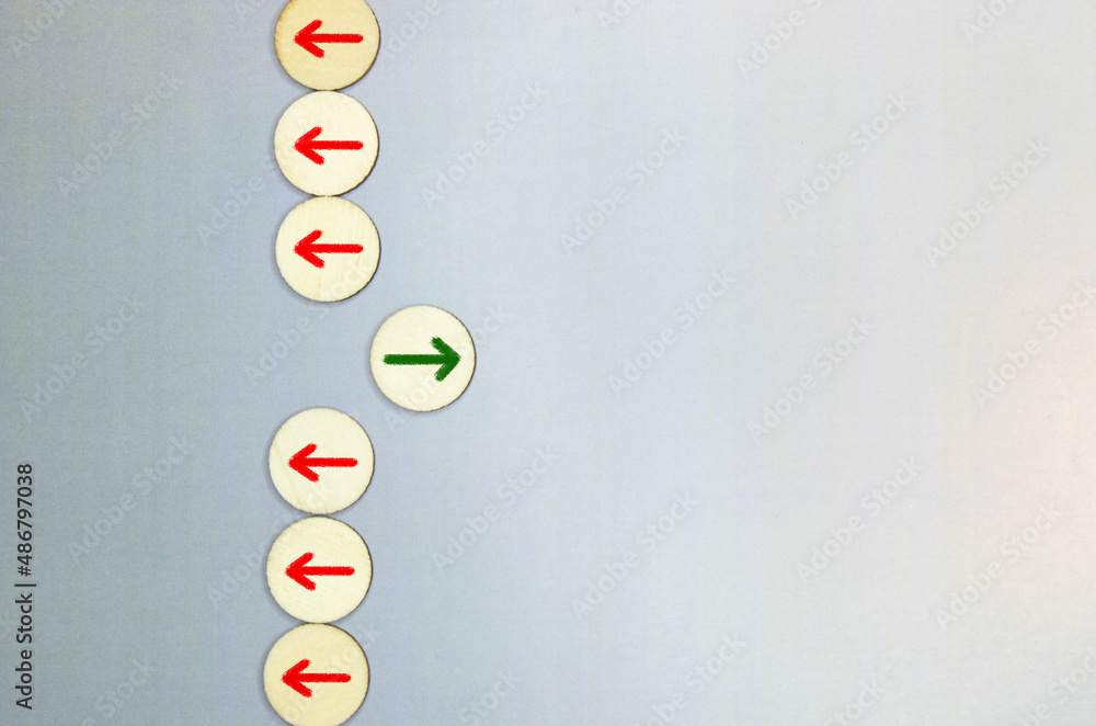 Poster red wooden block with arrow facing individual pointing in the different way on blue background