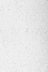 Abstract close up texture photo of compressed white styrofoam background..