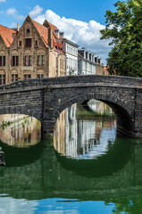 Old buildings along the canal in Bruges, Belgium