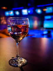 a glass of wine in a airport lounge.