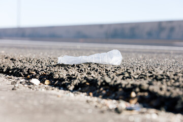 Plastic bottle lying alongside of roadway 