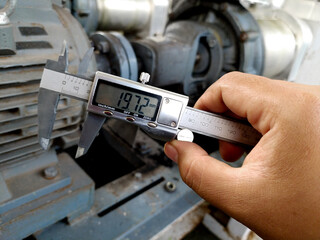 hand holding a measuring instrument