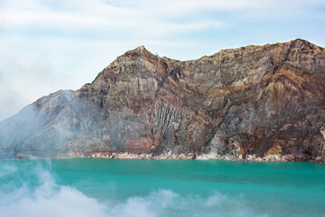 Blue sulfur lake at Kawah Ijen volcano mountain - Indonesia