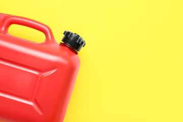 Plastic canister on color background
