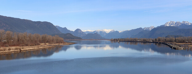 Perspective of river and snow-capped mountains
