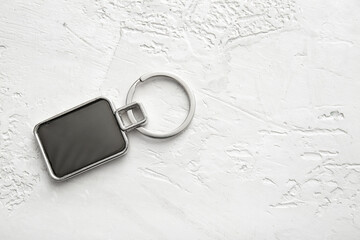 Stylish square keychain on white background - obrazy, fototapety, plakaty