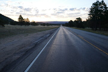 Fototapeta premium Shiny asphalt highway diminishing view at twilight time of day 