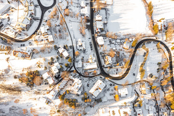 A snow-covered resort town in Poland from a bird's eye view. Winter landscape from above. Karpacz,...
