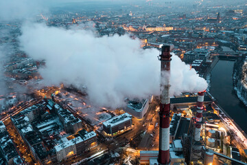 Aerial view of smog over the city, smoking chimneys of a thermal power plant and a panorama of the city. Wroclaw, Poland