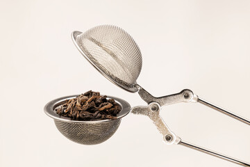 Metal sieve for brewing tea, green tea, black tea. On white background