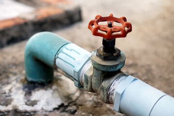 Old water pipe and valve installed on cement floor. Concept : plumping system. 