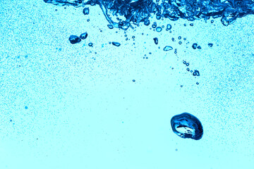 Clear water with air bubbles on blue background