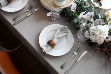 Stylish table setting with flowers