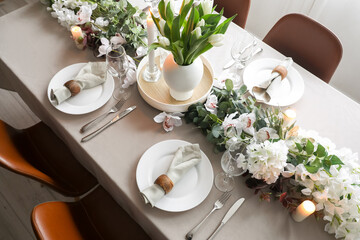 Stylish table setting with flowers