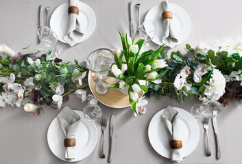Stylish table setting with tulip flowers