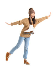 Little Asian girl in warm clothes with ice skates on white background