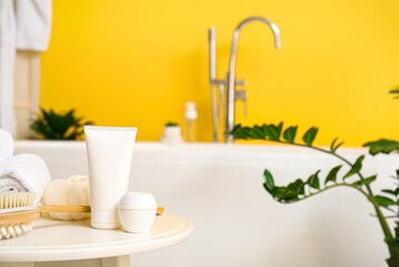 Different cosmetic products on table in bathroom