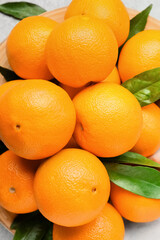 Fresh juicy oranges on table, closeup