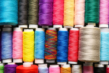 Set of spools with different sewing threads, closeup