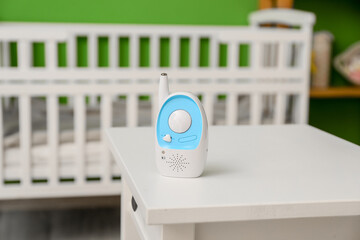 Fototapeta na wymiar Modern baby monitor on table in room