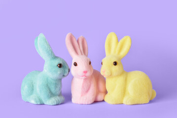 Cute Easter bunnies on purple background