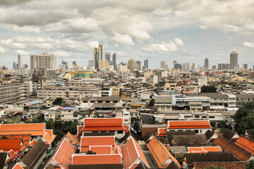 Fototapeta na wymiar Wide angle view from a bird's eye view of the old city of Bangkok, Wat Phukhao Thong in the background is a tall building in the business district