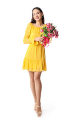 Beautiful young woman with bouquet of flowers on white background. International Women's Day celebration
