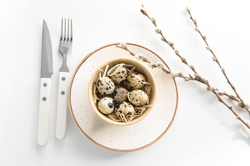 Beautiful Easter table setting with pussy willow branches on white background