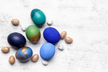 Different Easter eggs on light background