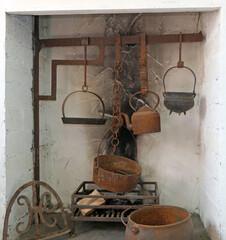 An open fire used for burning Turf and Pete for cooking in a old Irish Cottage © Peter Steele