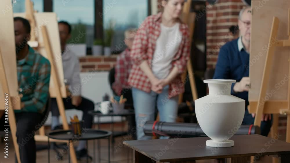 Poster vase on table used as inspiration model for students to draw on canvas, to practice drawing skills f