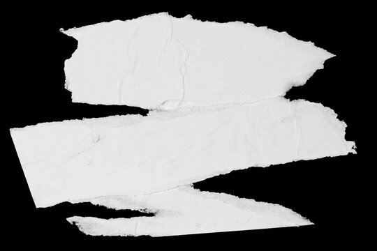 White paper ripped pieces isolated on black background. Dirty wrinkled glued paper poster texture