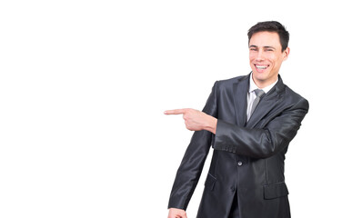 Cheerful smiling businessman pointing aside with finger