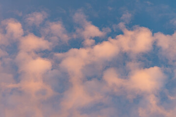 Sunset Clouds with Pink Hue and Blue background
